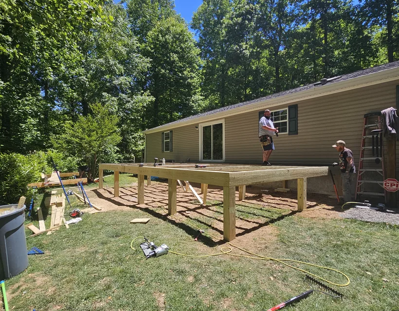 Lozica Builders crew framing a new deck on a residential property