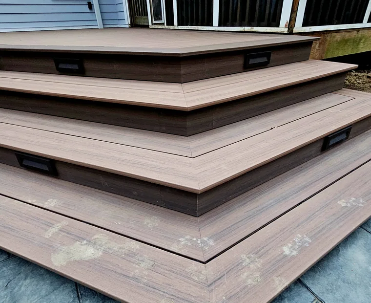 Mitred composite stair treads wrapping the corner of a deck