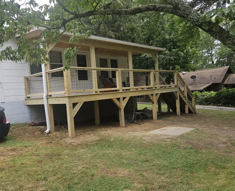 Elevated deck with a full staircase down to the yard